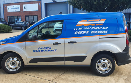 Silver van half wrapped with blue, orange and white vinyl