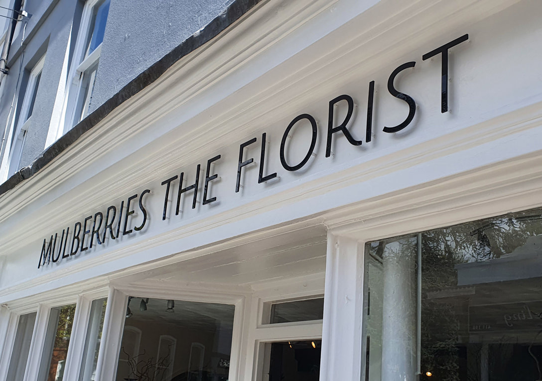 Shopfront signage with acrylic lettering onto a traditional fascia